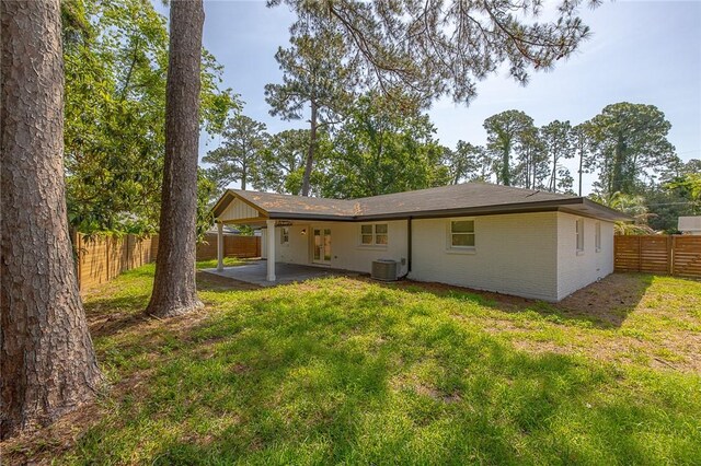 155 Mcdowell Ave, Brunswick, GA 31525 - rear view of house featuring a patio, brick siding, an attached carport, and cooling unit