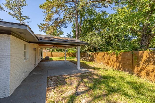 155 Mcdowell Ave, Brunswick, GA 31525 - view of yard featuring a patio and cooling unit
