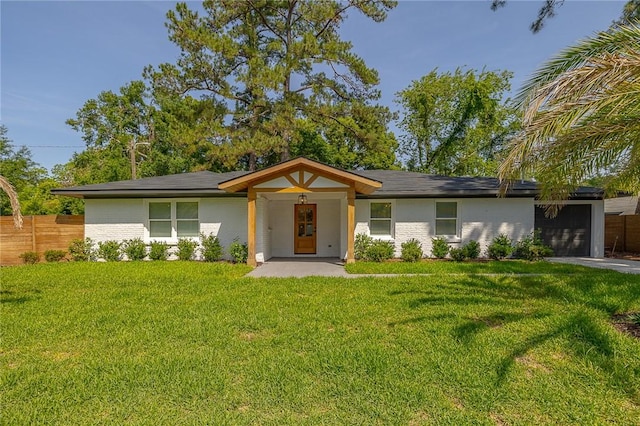 155 Mcdowell Ave, Brunswick, GA 31525 - view of front of property with an attached garage