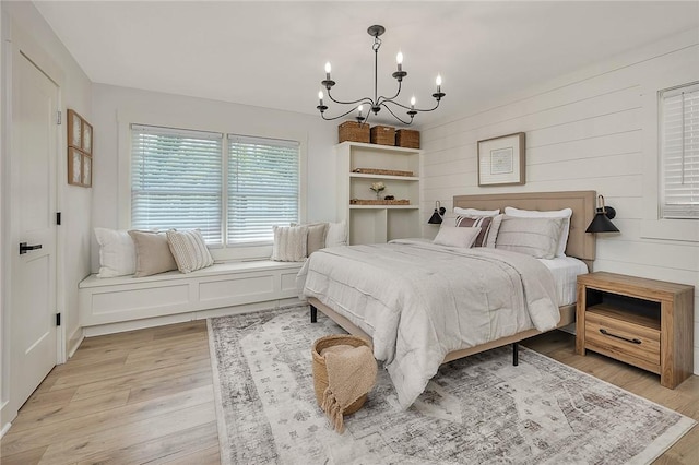 155 Mcdowell Ave, Brunswick, GA 31525 - bedroom with a chandelier and light wood-style floors