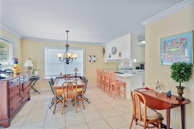 dining room featuring an inviting chandelier, ornamental molding, light tile patterned floors, and a healthy amount of sunlight