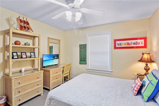carpeted bedroom featuring a ceiling fan