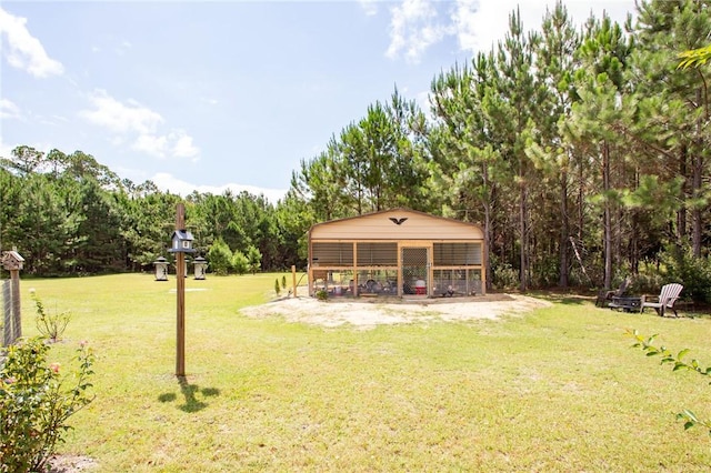 5618 Bowen Rd, Blackshear, GA 31516 - view of green lawn with an outbuilding and exterior structure