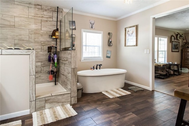 5618 Bowen Rd, Blackshear, GA 31516 - full bath featuring a freestanding tub, ornamental molding, wood finished floors, and a tile shower