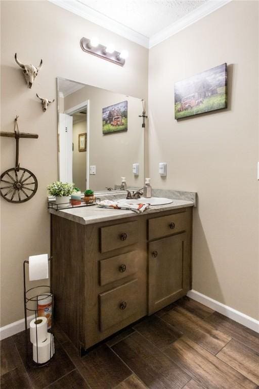 5618 Bowen Rd, Blackshear, GA 31516 - bathroom featuring crown molding, wood finished floors, and vanity