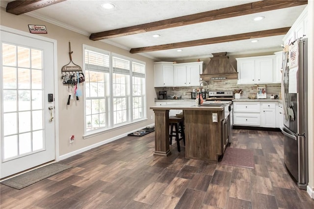 5618 Bowen Rd, Blackshear, GA 31516 - kitchen with stainless steel refrigerator, custom range hood, beamed ceiling, tasteful backsplash, and light countertops