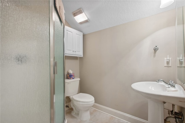 bathroom featuring tile patterned flooring, toilet, walk in shower, and lofted ceiling