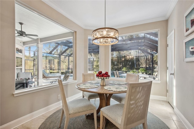 sunroom featuring ceiling fan with notable chandelier