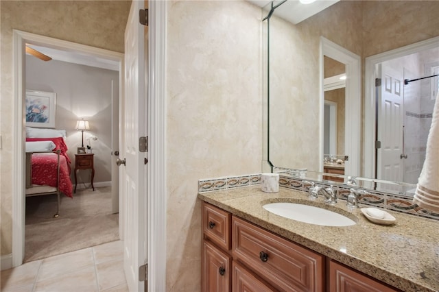 bathroom with tile patterned floors and vanity