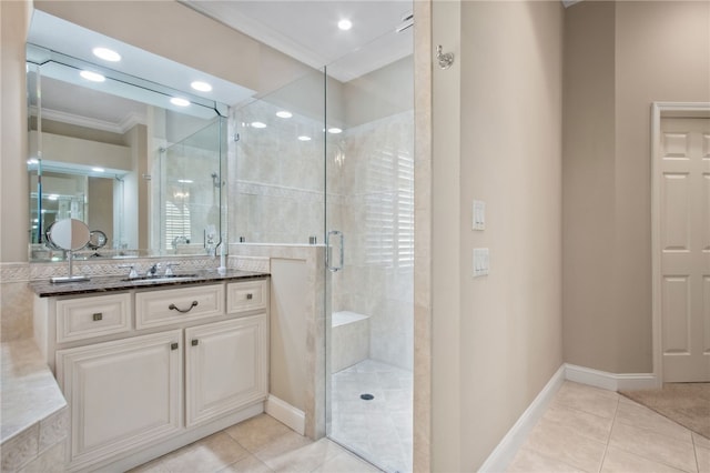 bathroom with vanity, tile patterned floors, walk in shower, and ornamental molding