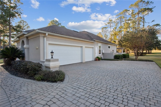 view of side of property featuring a garage