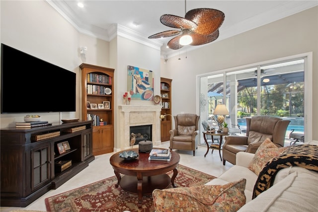 living room featuring a high end fireplace and ornamental molding