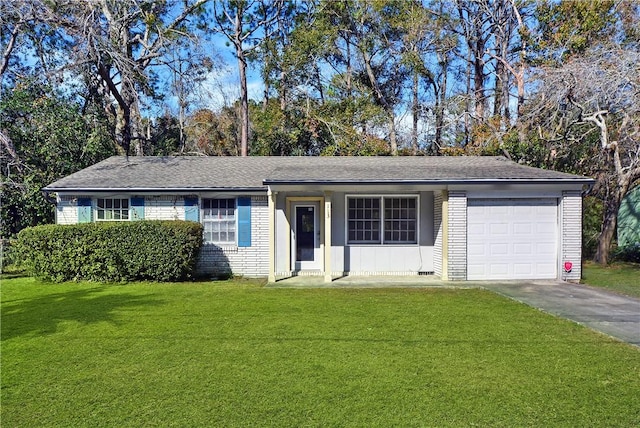 single story home featuring a garage, brick siding, a front yard, and driveway