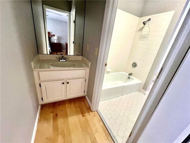 bathroom featuring vanity, shower / bath combination, and wood-type flooring