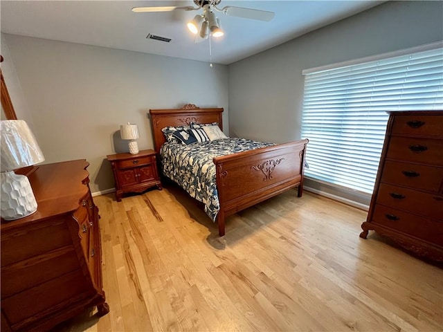 bedroom featuring ceiling fan and light hardwood / wood-style flooring