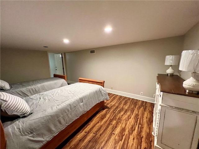 bedroom with hardwood / wood-style floors