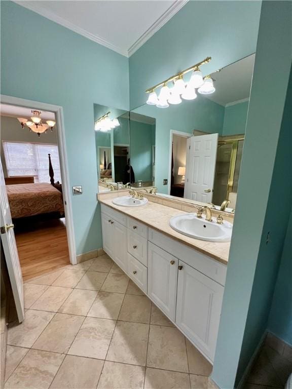 bathroom with tile patterned flooring, vanity, ornamental molding, and a shower with door