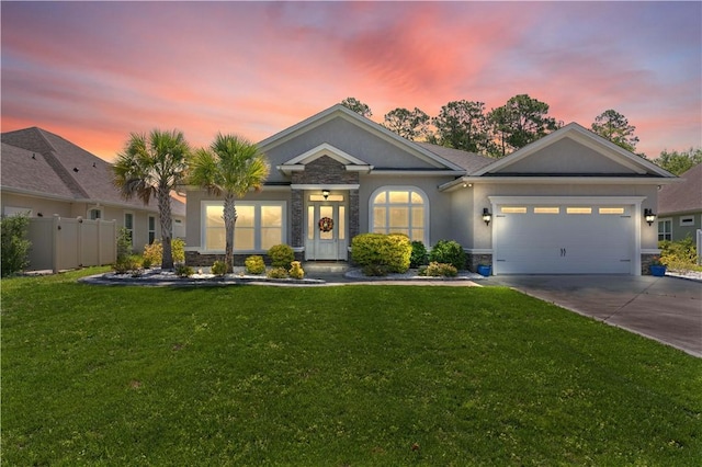 view of front facade featuring a yard and a garage