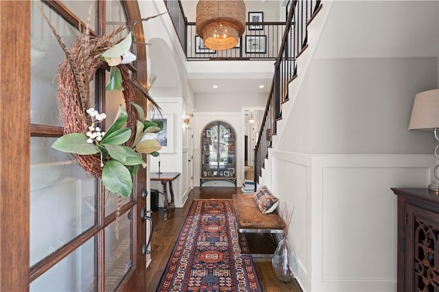 entrance foyer with dark hardwood / wood-style flooring