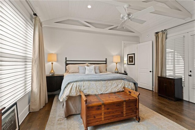 bedroom with dark hardwood / wood-style flooring, vaulted ceiling with beams, ceiling fan, and wood ceiling