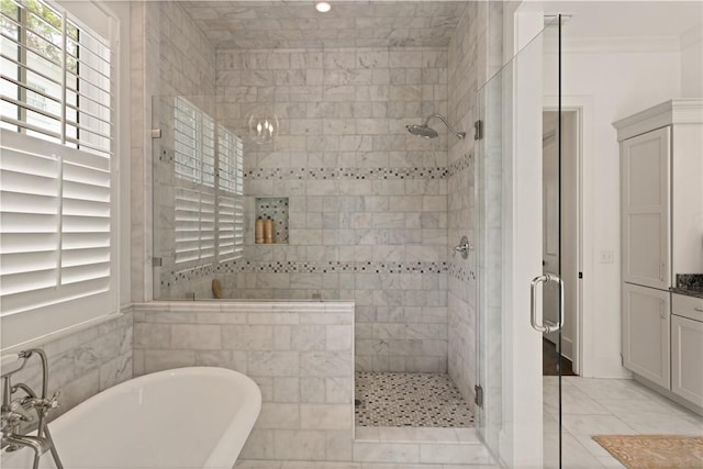 bathroom featuring tile patterned flooring, vanity, and independent shower and bath