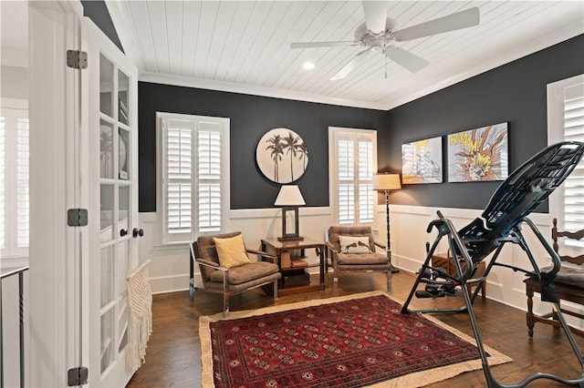 workout room featuring ceiling fan, dark hardwood / wood-style flooring, ornamental molding, and wood ceiling