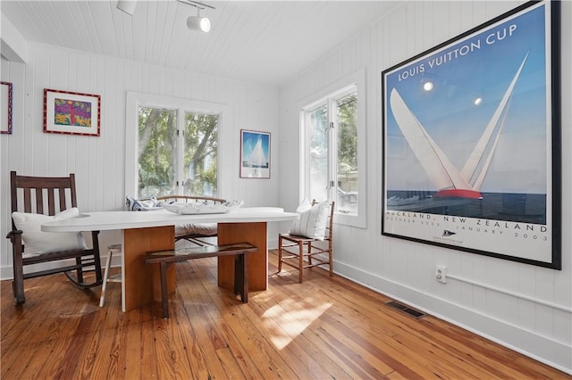4206 Tenth St, Saint Simons Island, GA 31522 - dining space featuring hardwood / wood-style floors, plenty of natural light, and baseboards
