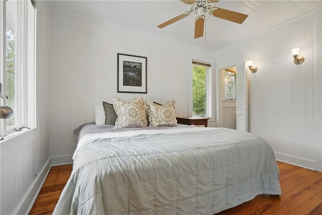 4206 Tenth St, Saint Simons Island, GA 31522 - bedroom with wood finished floors, baseboards, ornamental molding, and ceiling fan