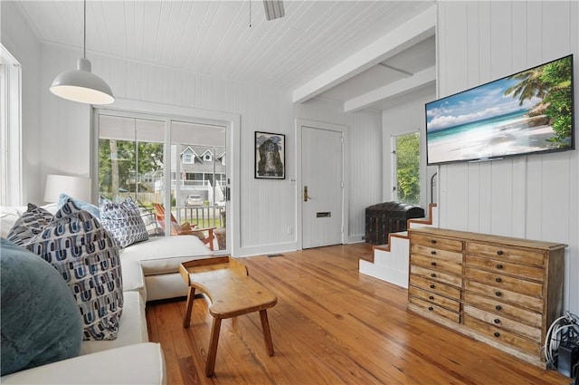 4206 Tenth St, Saint Simons Island, GA 31522 - living room with hardwood / wood-style flooring, beamed ceiling, and a ceiling fan