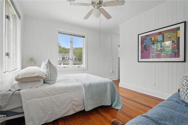 4206 Tenth St, Saint Simons Island, GA 31522 - bedroom with wood finished floors, baseboards, and ceiling fan
