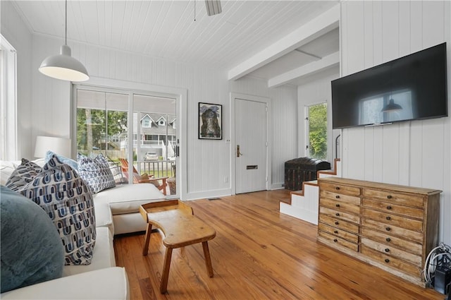 4206 Tenth St, Saint Simons Island, GA 31522 - living area with wood finished floors, beamed ceiling, and ceiling fan