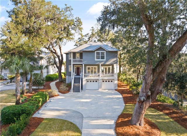 view of front of house featuring covered porch and a garage