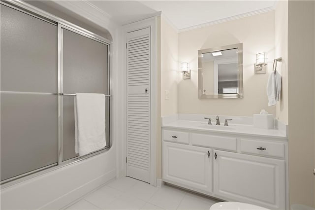 bathroom with vanity, ornamental molding, and enclosed tub / shower combo