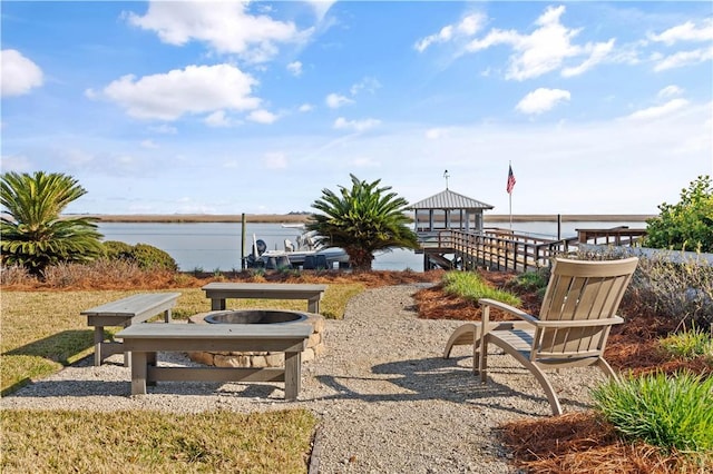 view of patio / terrace featuring a gazebo and a water view