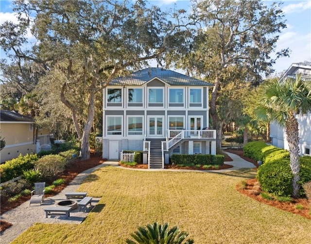 rear view of property with a lawn