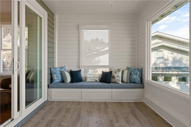 unfurnished sunroom featuring plenty of natural light and lofted ceiling