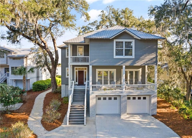 front facade with a porch and a garage