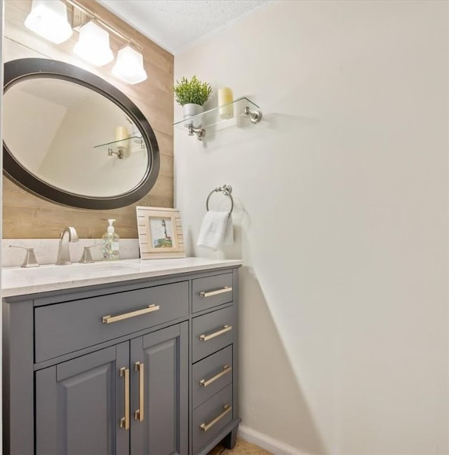 bathroom featuring vanity and a textured ceiling