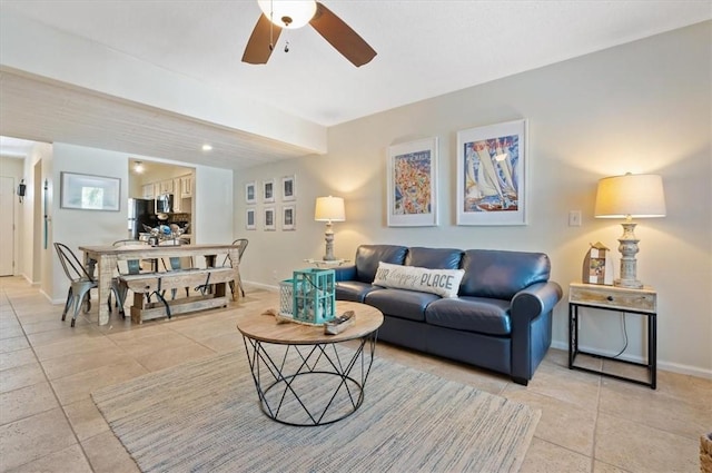 tiled living room with ceiling fan