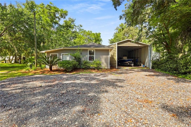 1152 Julienton Lndg NE, Townsend, GA 31331 - view of front of house with a detached carport and gravel driveway