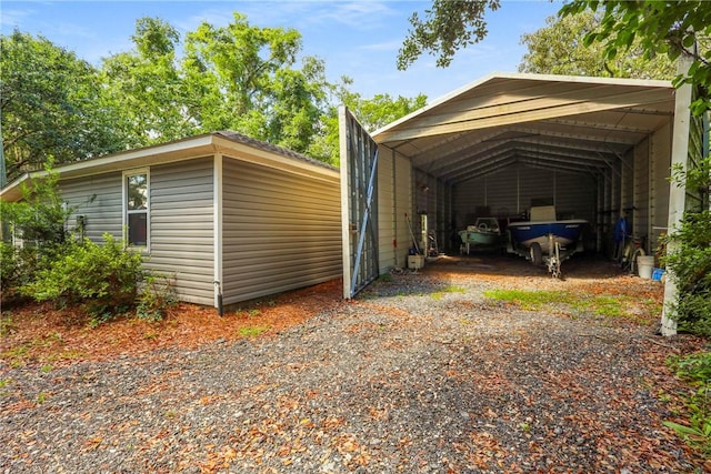 1152 Julienton Lndg NE, Townsend, GA 31331 - view of vehicle parking with gravel driveway and a detached carport
