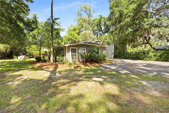 1152 Julienton Lndg NE, Townsend, GA 31331 - view of side of property with a yard and view of scattered trees