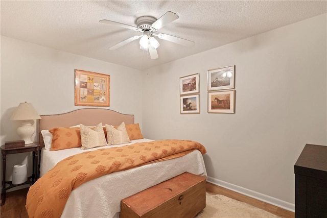 1152 Julienton Lndg NE, Townsend, GA 31331 - bedroom featuring baseboards, wood finished floors, and ceiling fan