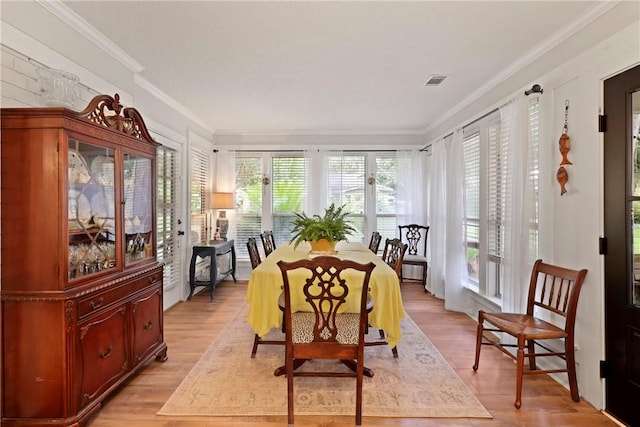 1152 Julienton Lndg NE, Townsend, GA 31331 - dining space featuring healthy amount of natural light, crown molding, and light wood finished floors