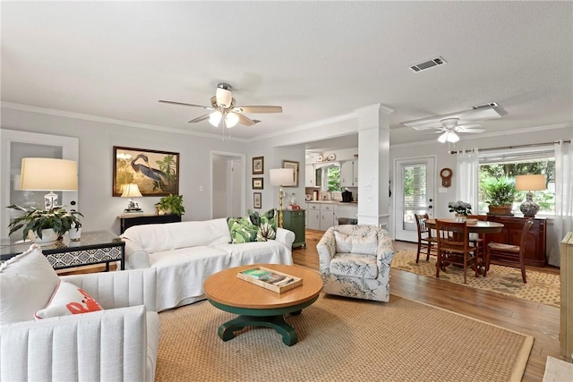 1152 Julienton Lndg NE, Townsend, GA 31331 - living room with ceiling fan, wood finished floors, and crown molding