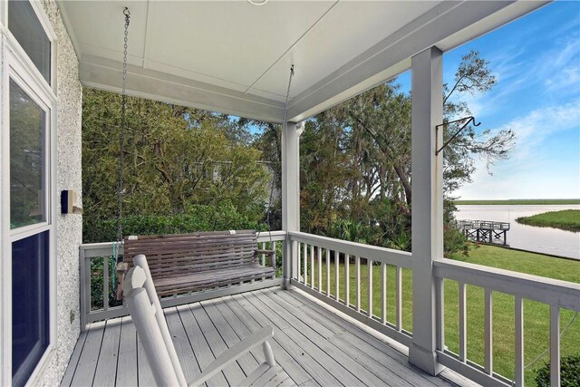 wooden terrace with a yard