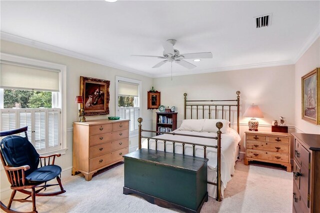 bedroom featuring multiple windows, ceiling fan, light colored carpet, and ornamental molding