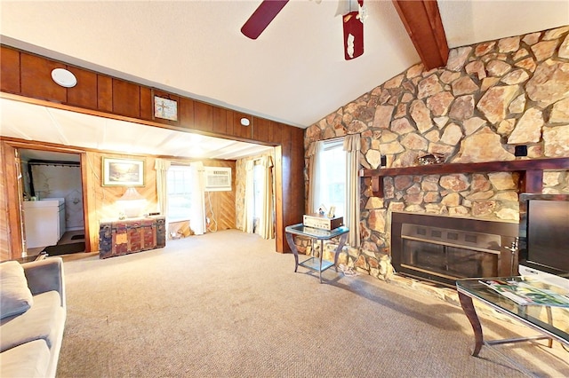 1013 E Waring St, Waycross, GA 31501 - carpeted living room featuring a fireplace, vaulted ceiling with beams, a wealth of natural light, and wood walls