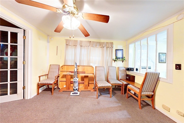 sitting room featuring carpet flooring and ceiling fan