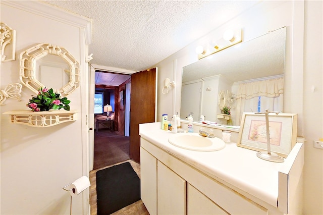 1013 E Waring St, Waycross, GA 31501 - bathroom with vanity and a textured ceiling